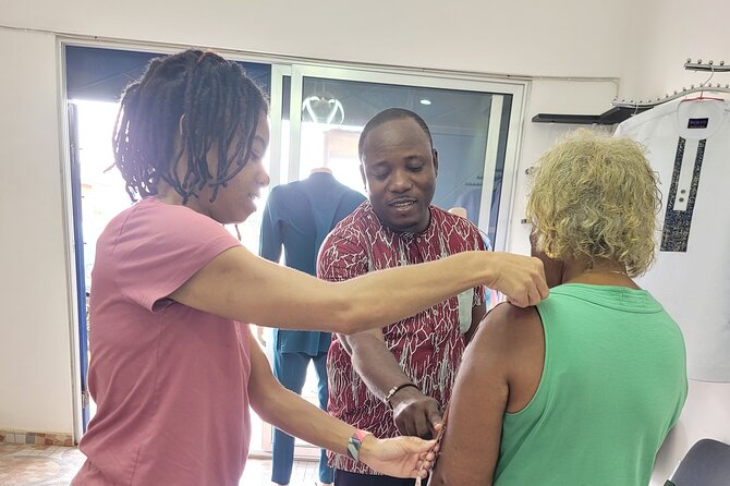 African custom clothing making experience with fabric tour - Cutting fabric and building the garment